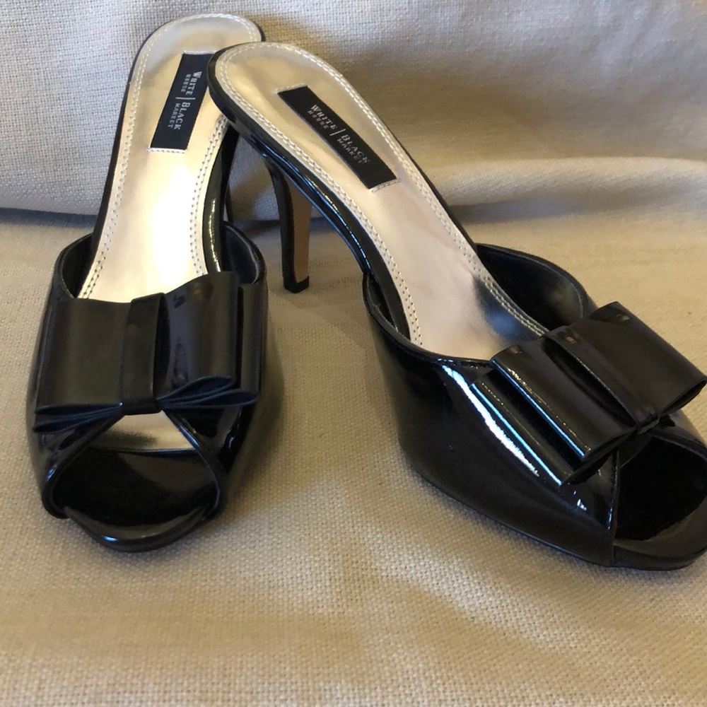 White House Black Market Daria high heel slide. Black patent, size 8, peep toe.